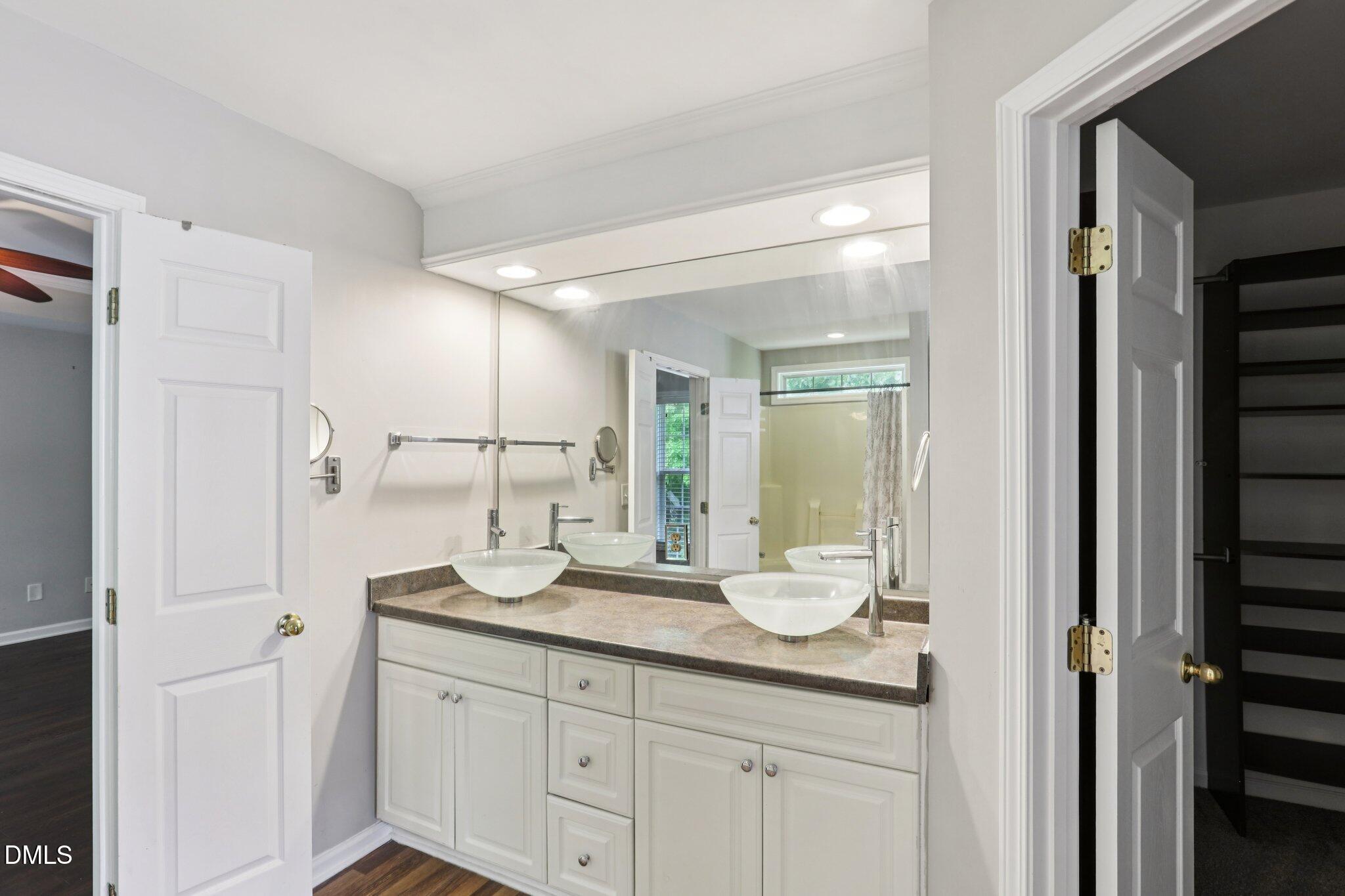 1212 Southgate Drive Raleigh, NC 27610 - Photo 18 of 31 a bathroom with a granite countertop sink mirror and double