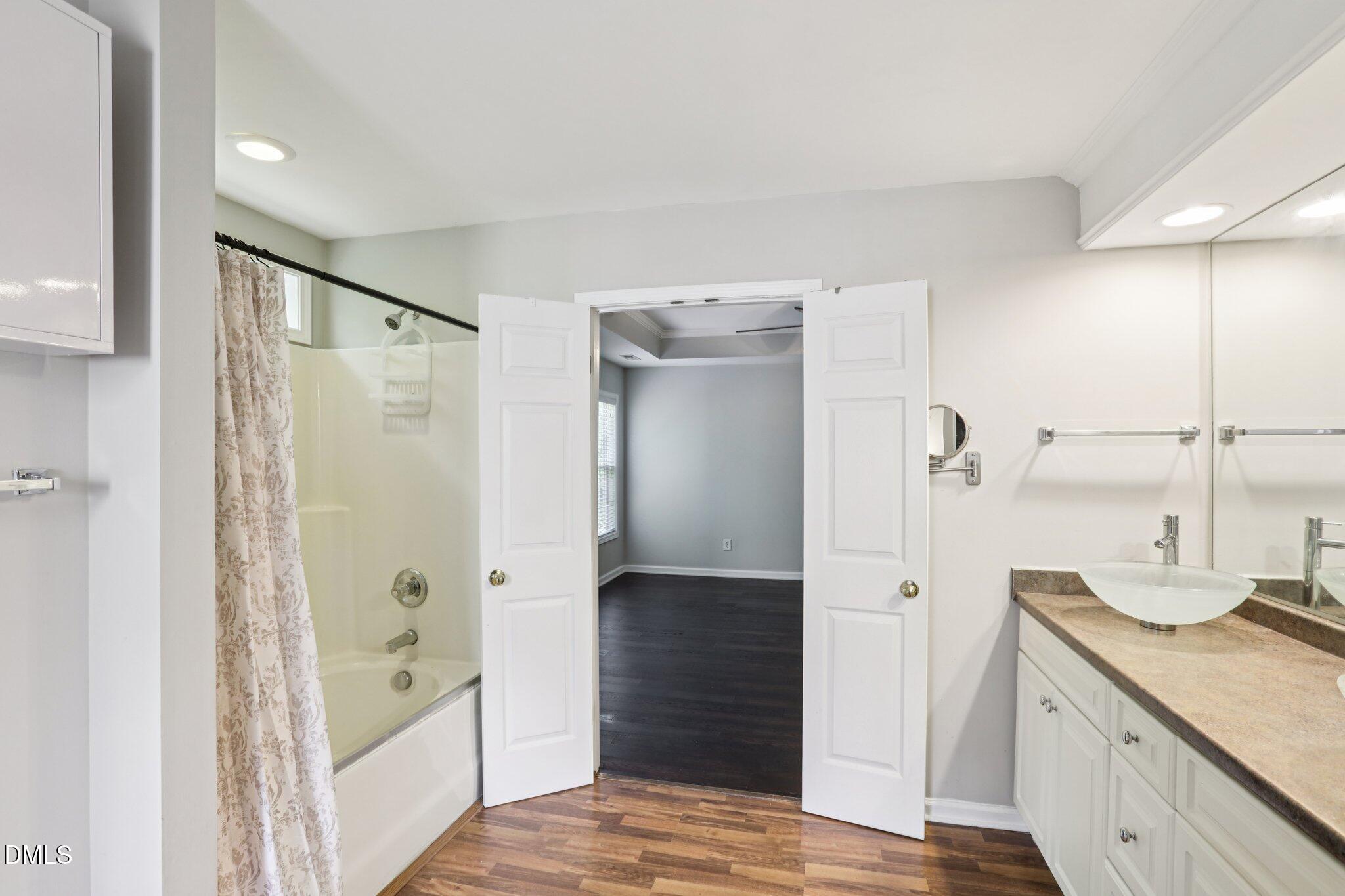 1212 Southgate Drive Raleigh, NC 27610 - Photo 19 of 31 a bathroom with a shower and a sink