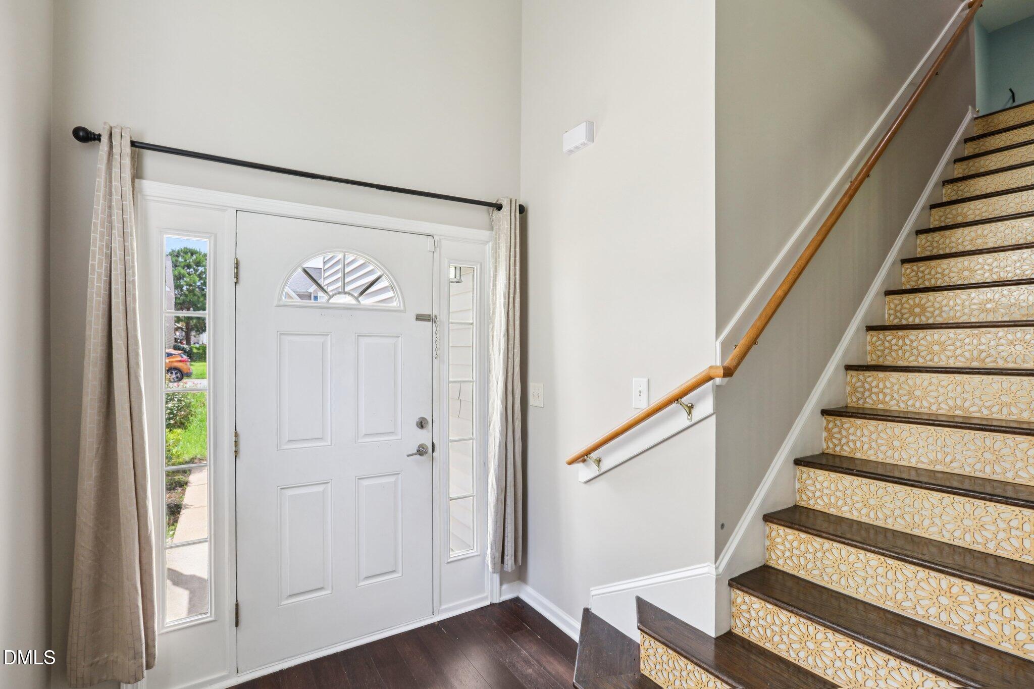 1212 Southgate Drive Raleigh, NC 27610 - Photo 5 of 31 a view of entryway with wooden floor