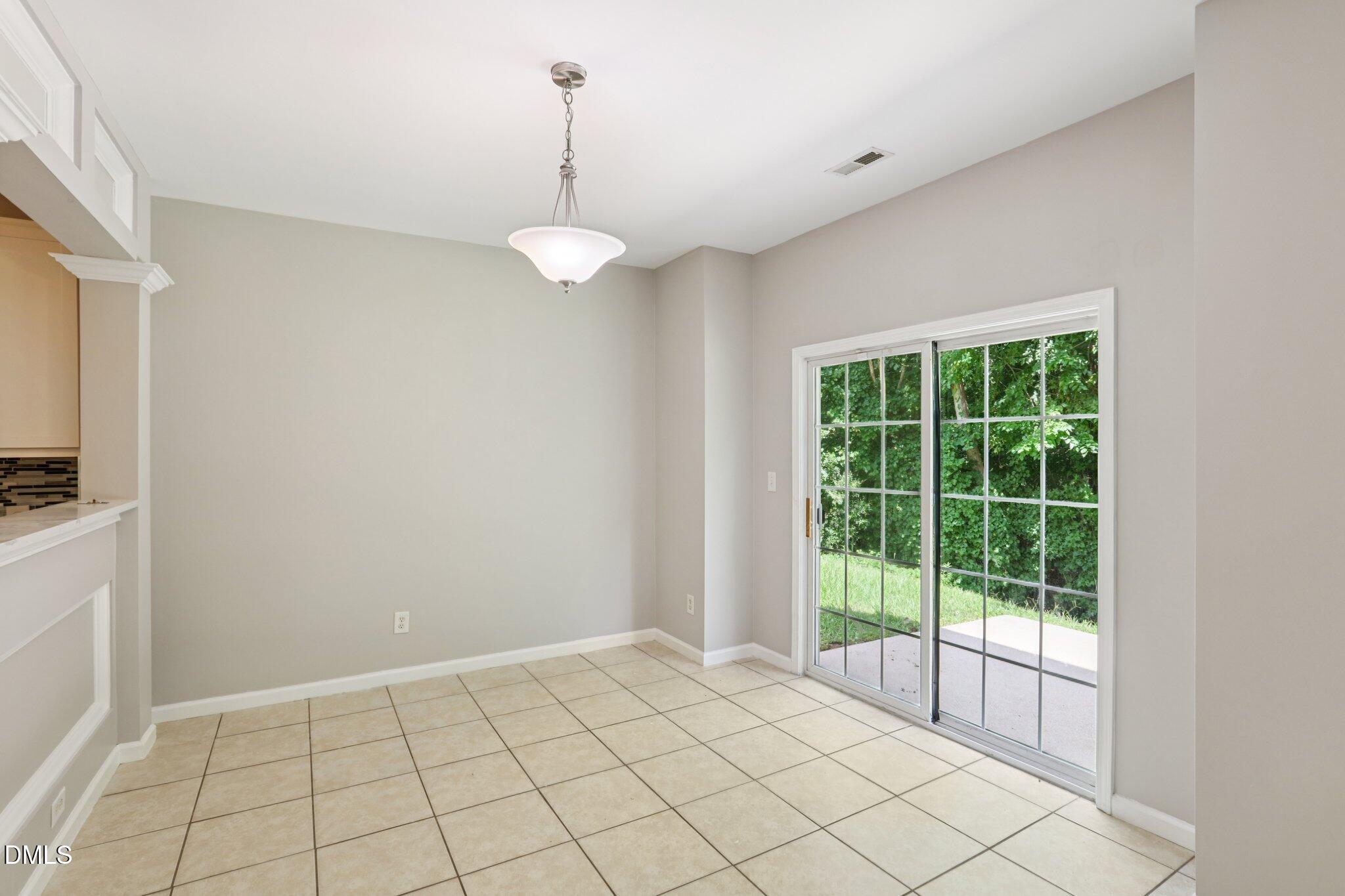 1212 Southgate Drive Raleigh, NC 27610 - Photo 8 of 31 a view of an empty room and window