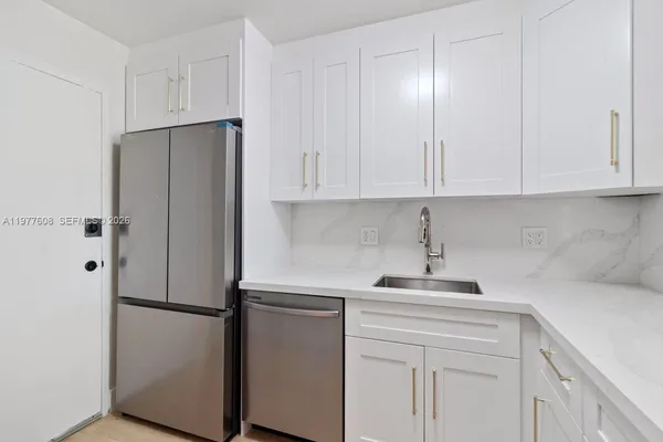 a kitchen with a sink and cabinets