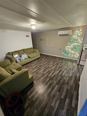 a living room with couch and a rug