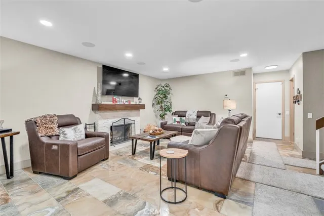 a large kitchen with stainless steel appliances lots of counter space and a refrigerator