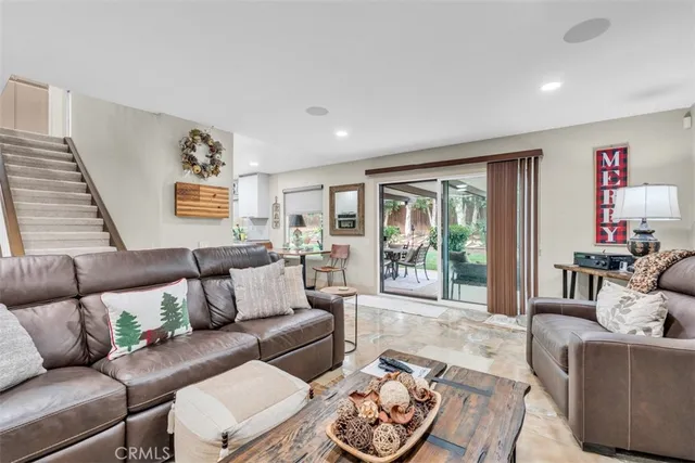 a kitchen with stainless steel appliances granite countertop white cabinets and a sink