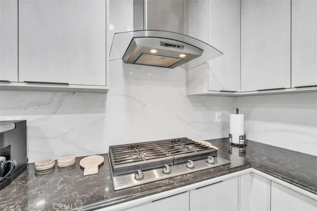 a view of a closet with furniture and a potted plant