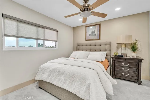a view of a patio with table and chairs and potted plants