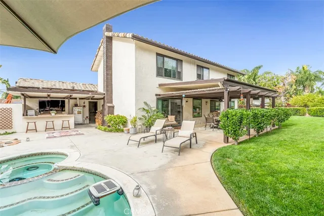 a view of a swimming pool with a patio