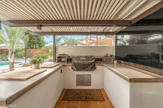 an aerial view of residential houses with outdoor space and garden