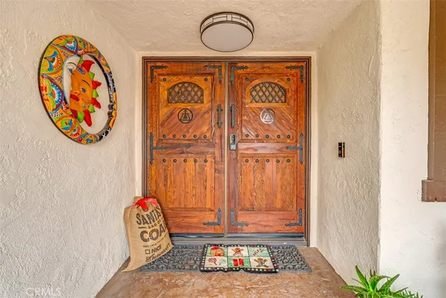 a living room with furniture and flowers