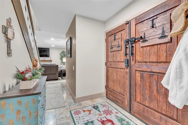 a living room with furniture and a lamp