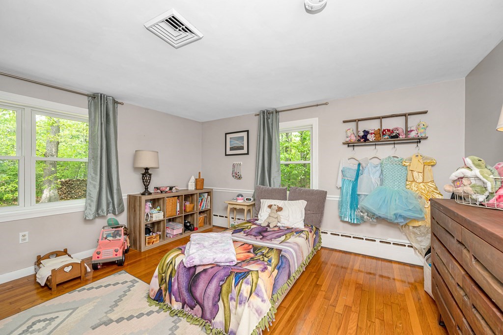 222 Gates Pond Road Berlin, MA 01503 - Photo 16 of 36 a bed room with a bed and a window