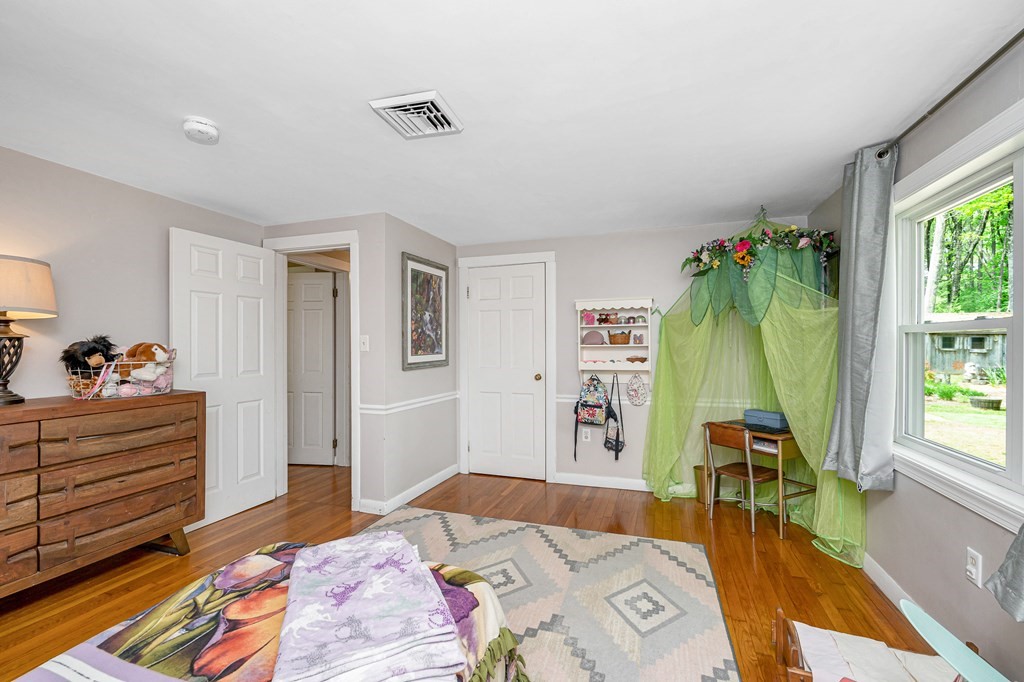 222 Gates Pond Road Berlin, MA 01503 - Photo 18 of 36 a bed room with a bed and a television