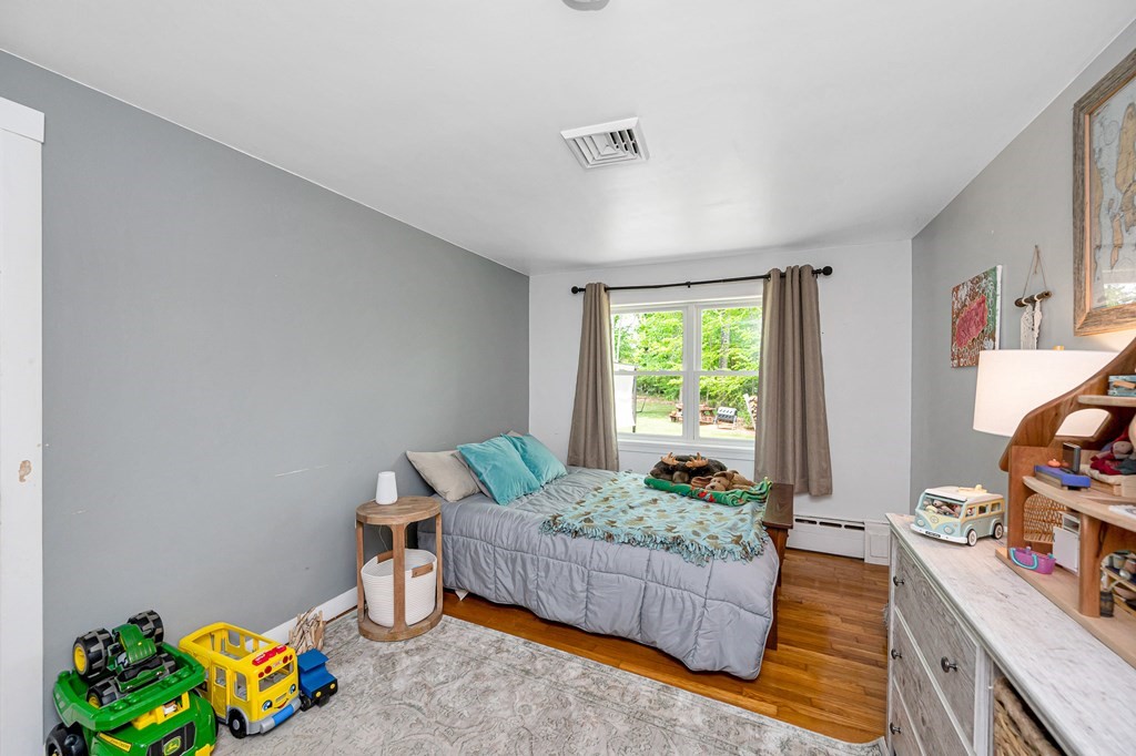 222 Gates Pond Road Berlin, MA 01503 - Photo 20 of 36 a bedroom with a bed and a window
