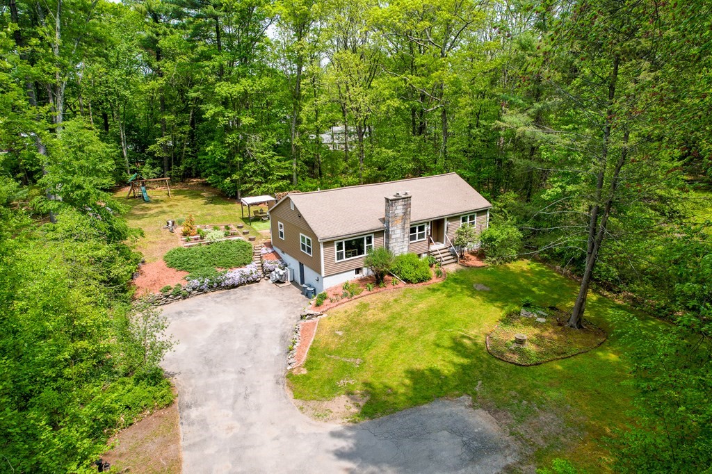 222 Gates Pond Road Berlin, MA 01503 - Photo 2 of 36 a backyard of a house with yard and outdoor seating