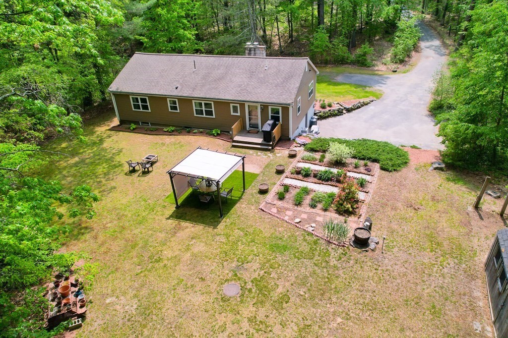 222 Gates Pond Road Berlin, MA 01503 - Photo 24 of 36 an aerial view of a house with swimming pool and yard