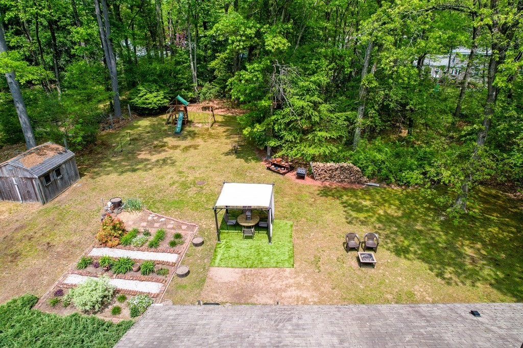 222 Gates Pond Road Berlin, MA 01503 - Photo 25 of 36 a view of a yard with plants