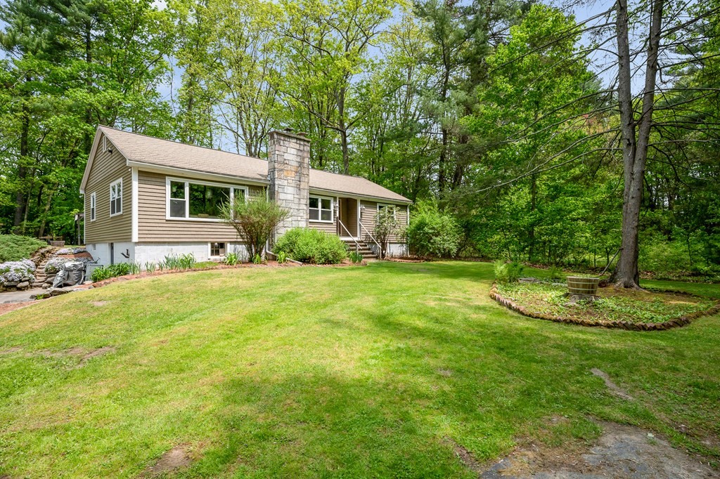 222 Gates Pond Road Berlin, MA 01503 - Photo 29 of 36 a view of house with backyard