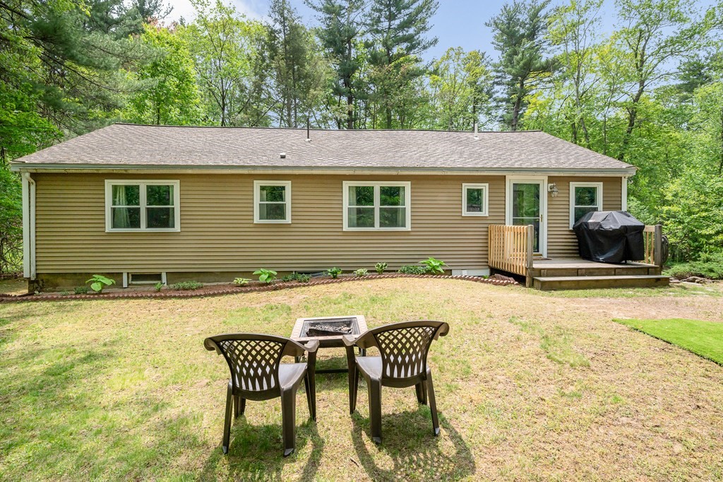 222 Gates Pond Road Berlin, MA 01503 - Photo 32 of 36 a view of a house with swimming pool and sitting area
