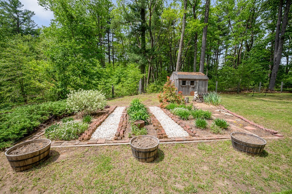 222 Gates Pond Road Berlin, MA 01503 - Photo 34 of 36 a view of a backyard with sitting area
