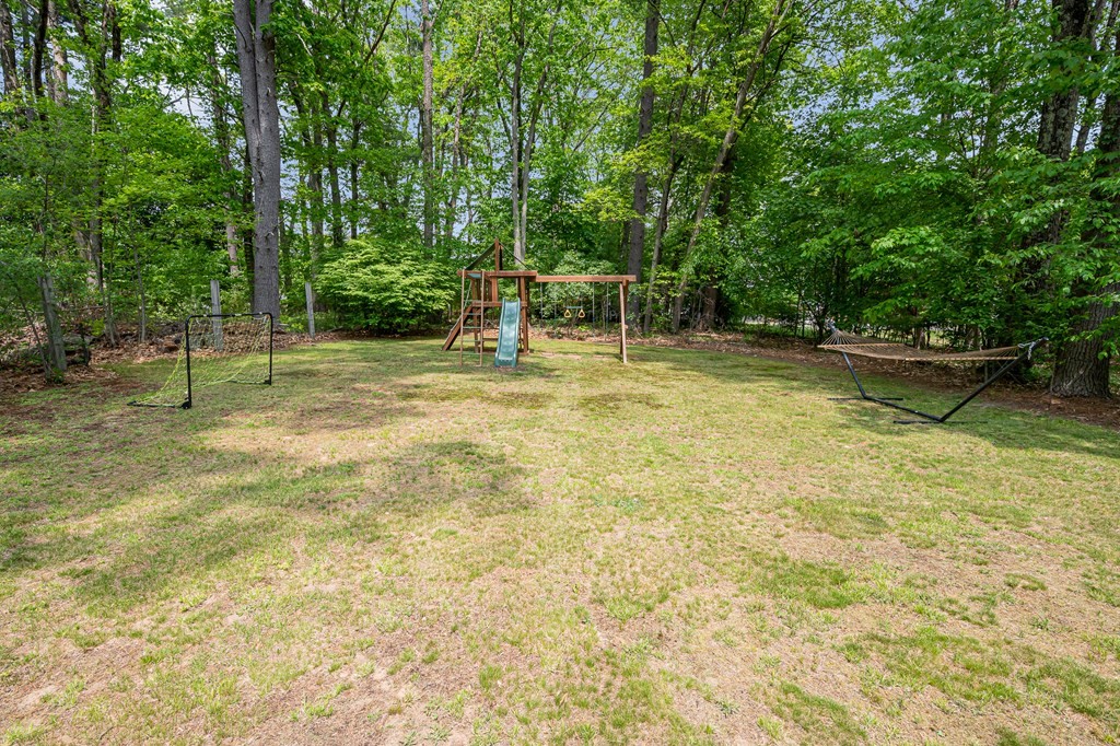 222 Gates Pond Road Berlin, MA 01503 - Photo 35 of 36 a view of a backyard with swimming pool