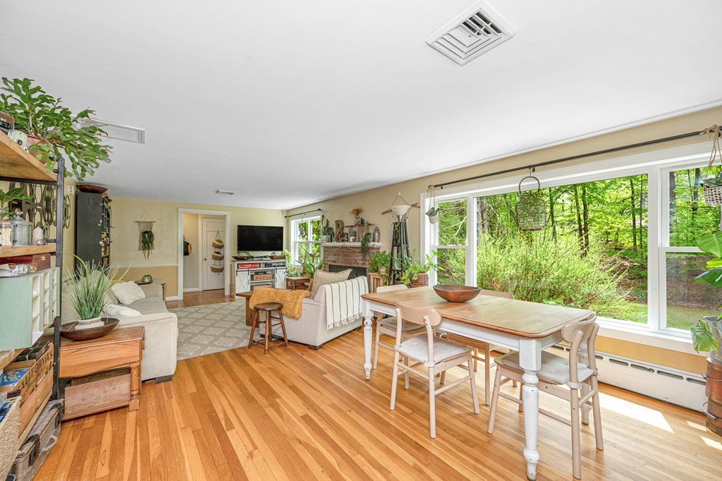 222 Gates Pond Road Berlin, MA 01503 - Photo 8 of 36 a living room with furniture and a large window