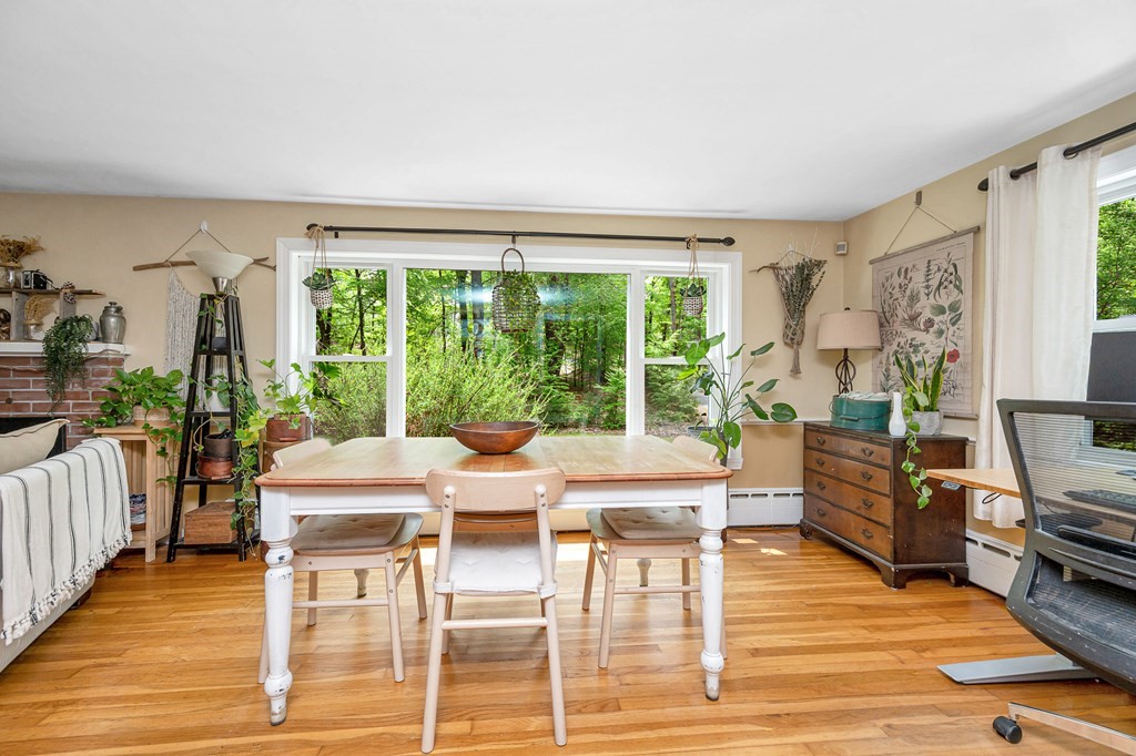 222 Gates Pond Road Berlin, MA 01503 - Photo 9 of 36 a view of a dining room with furniture window and wooden floor