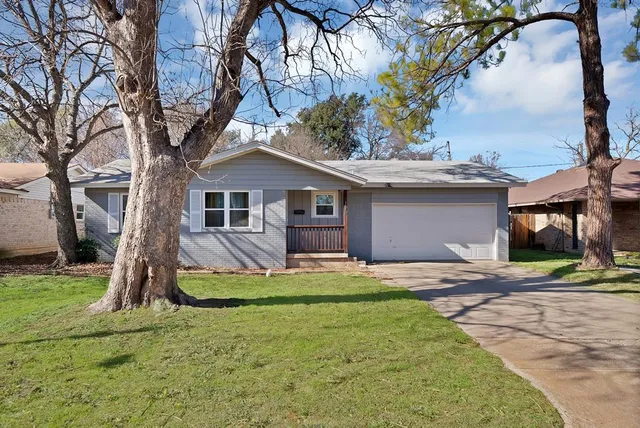 a house with trees in the background