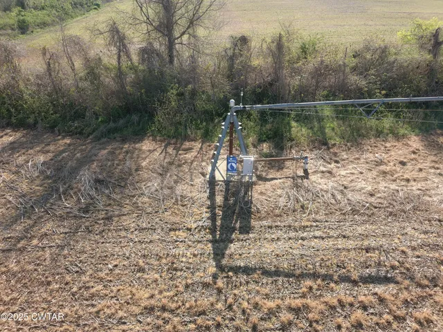 a view of a lake with a yard