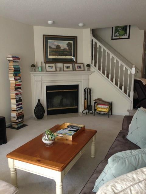 633 Danbury Road, Unit 20 Ridgefield, CT 06877 - Photo 1 of 1 a living room with furniture and a fireplace
