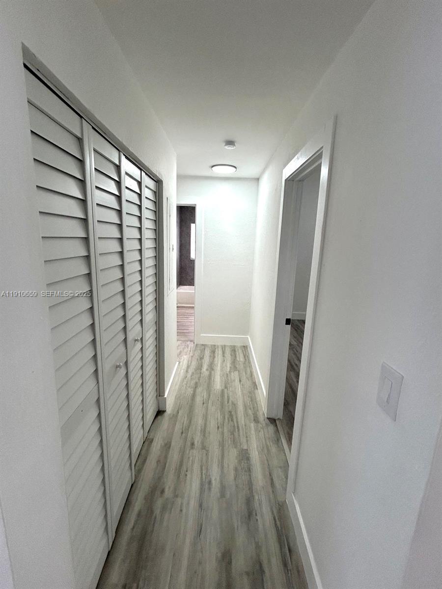 14211 Southwest 286th Street Homestead, FL 33033 - Photo 19 of 38 a view of a room with wooden floor and staircase