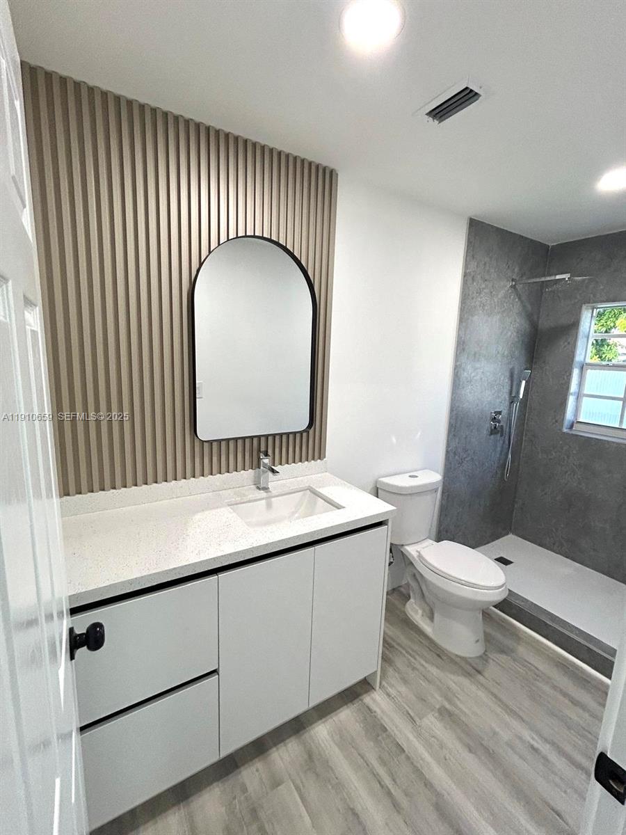 14211 Southwest 286th Street Homestead, FL 33033 - Photo 26 of 38 a bathroom with a sink and a mirror