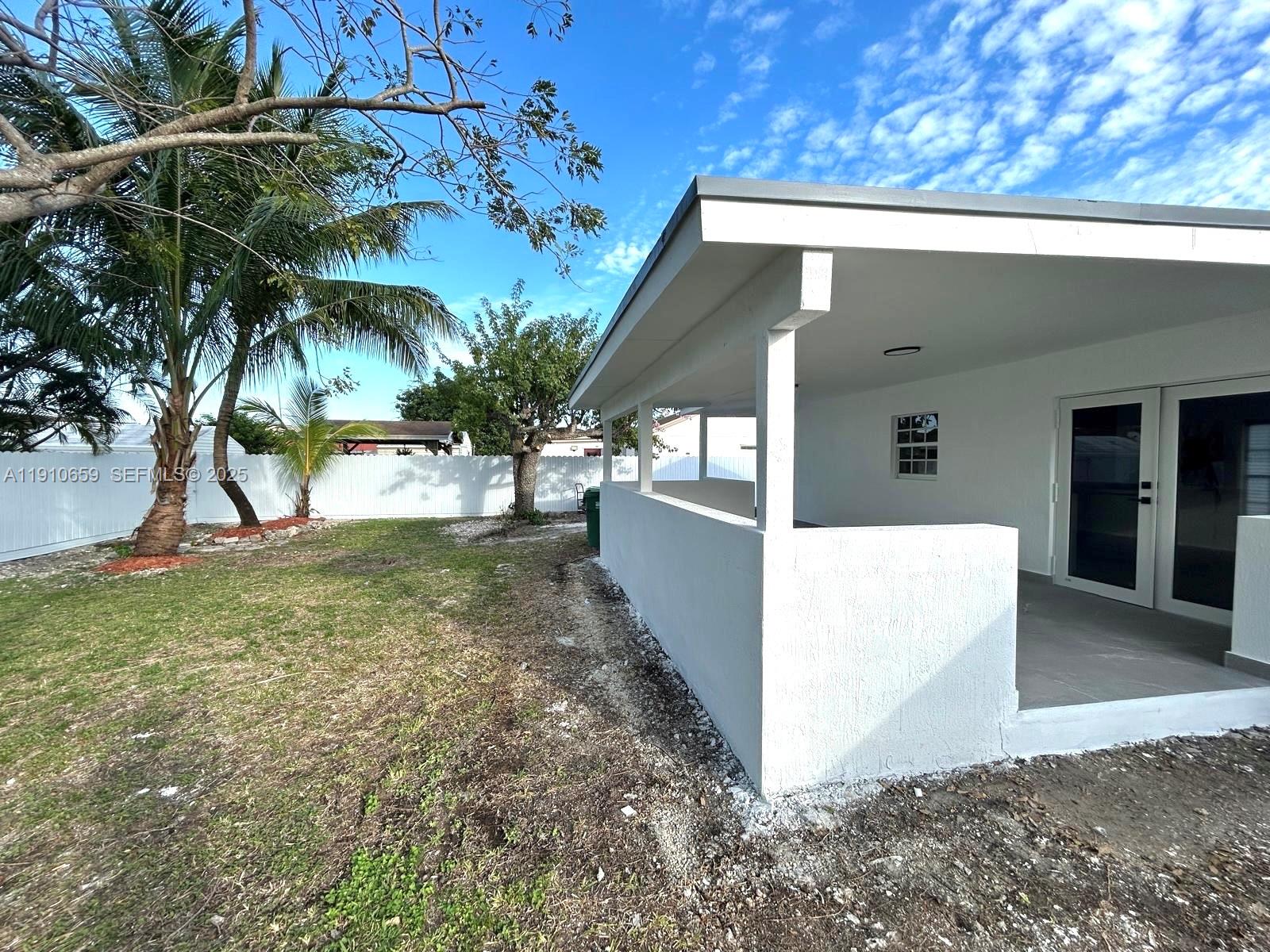 14211 Southwest 286th Street Homestead, FL 33033 - Photo 31 of 38 a view of a house with a yard