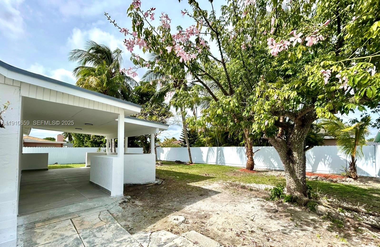 14211 Southwest 286th Street Homestead, FL 33033 - Photo 33 of 38 a view of a house with backyard and a tree