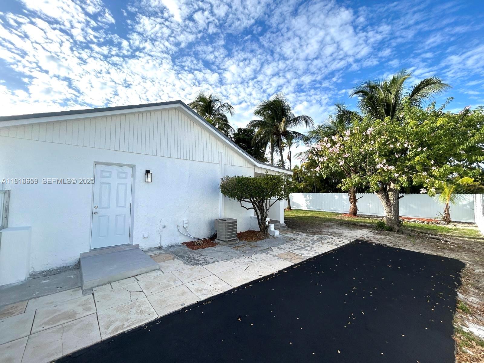 14211 Southwest 286th Street Homestead, FL 33033 - Photo 35 of 38 a view of a house with a backyard