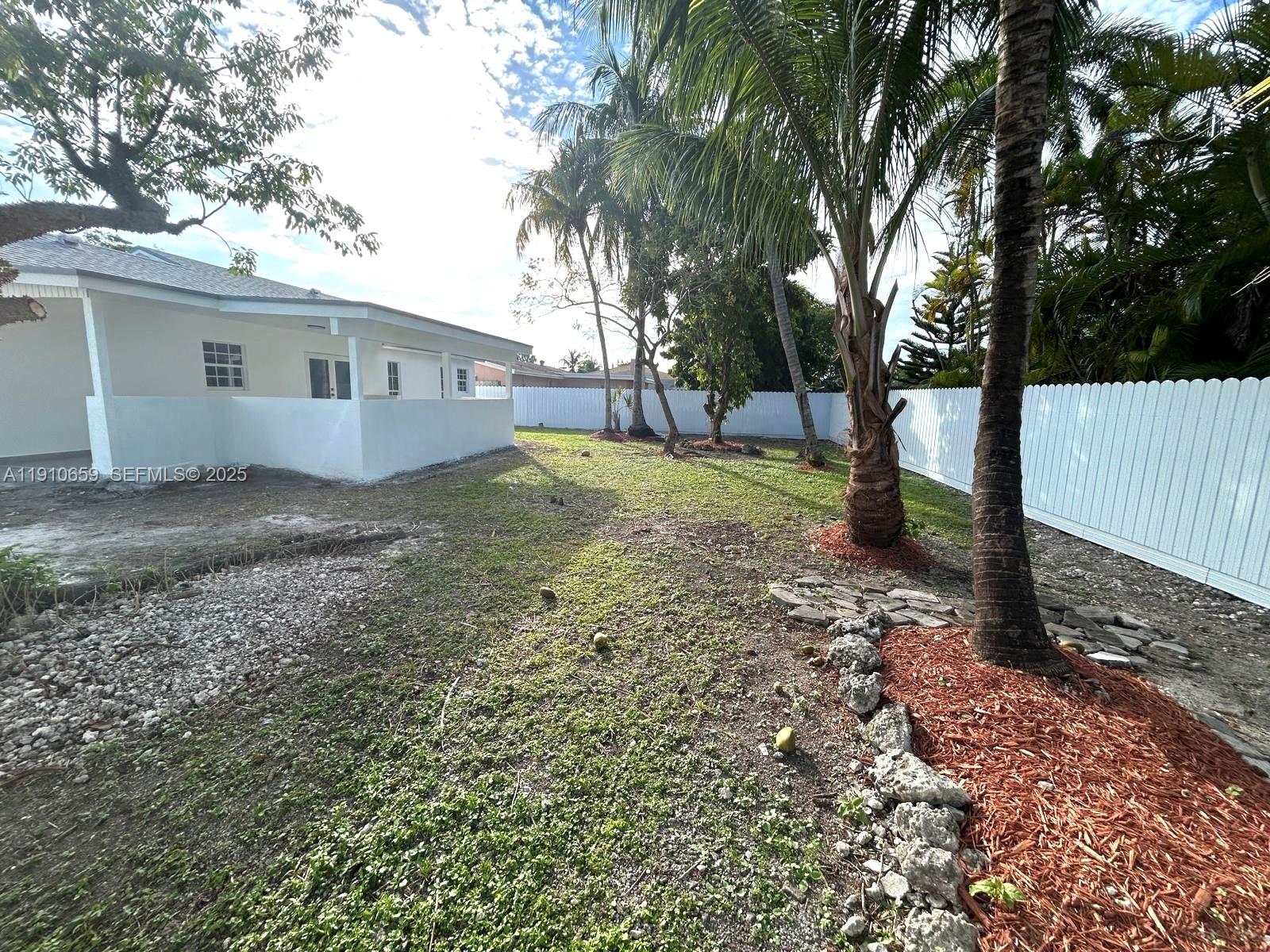 14211 Southwest 286th Street Homestead, FL 33033 - Photo 36 of 38 a view of a house with a yard