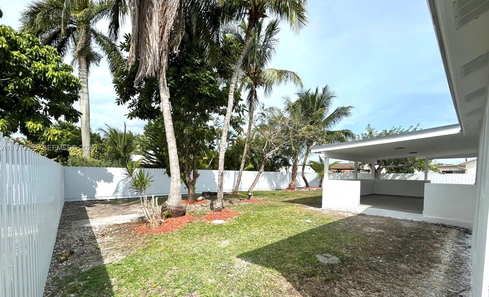 14211 Southwest 286th Street Homestead, FL 33033 - Photo 38 of 38 a view of a backyard with a garden