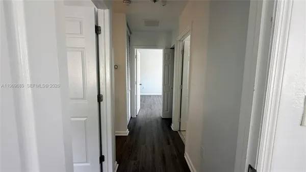 a view of a bathroom from the hallway