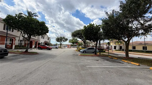 a view of a street with cars on road