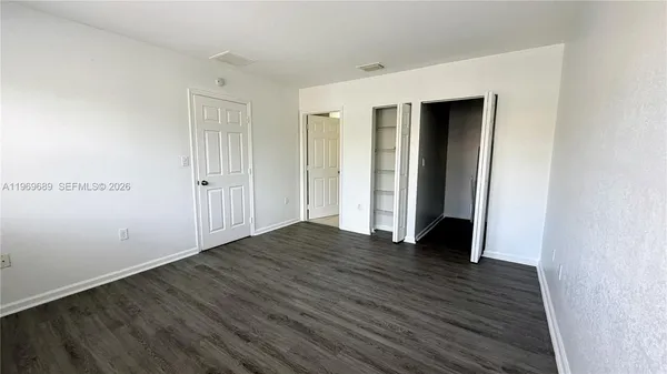 a view of wooden floor in an empty room