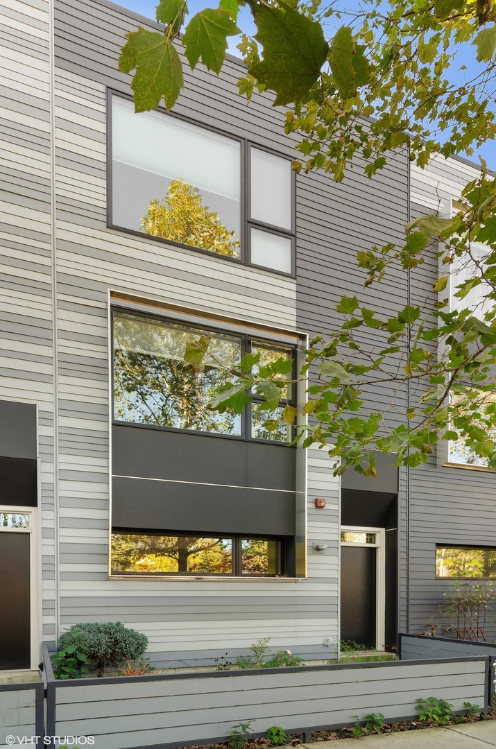 a view of a entryway door front of a house with a road