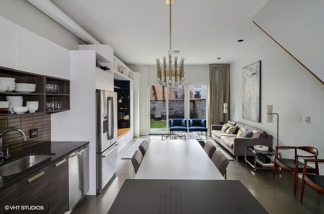 2811 West Shakespeare Avenue Chicago, IL 60647 - Photo 9 of 20 a living room with furniture a rug and a chandelier