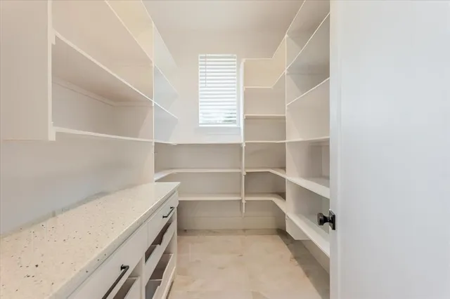 a view of an empty walk in closet