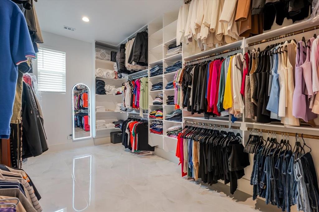 7381 Mesquite Ridge Sanger, TX 76266 - Photo 18 of 40 a view of walk in closet with clothes