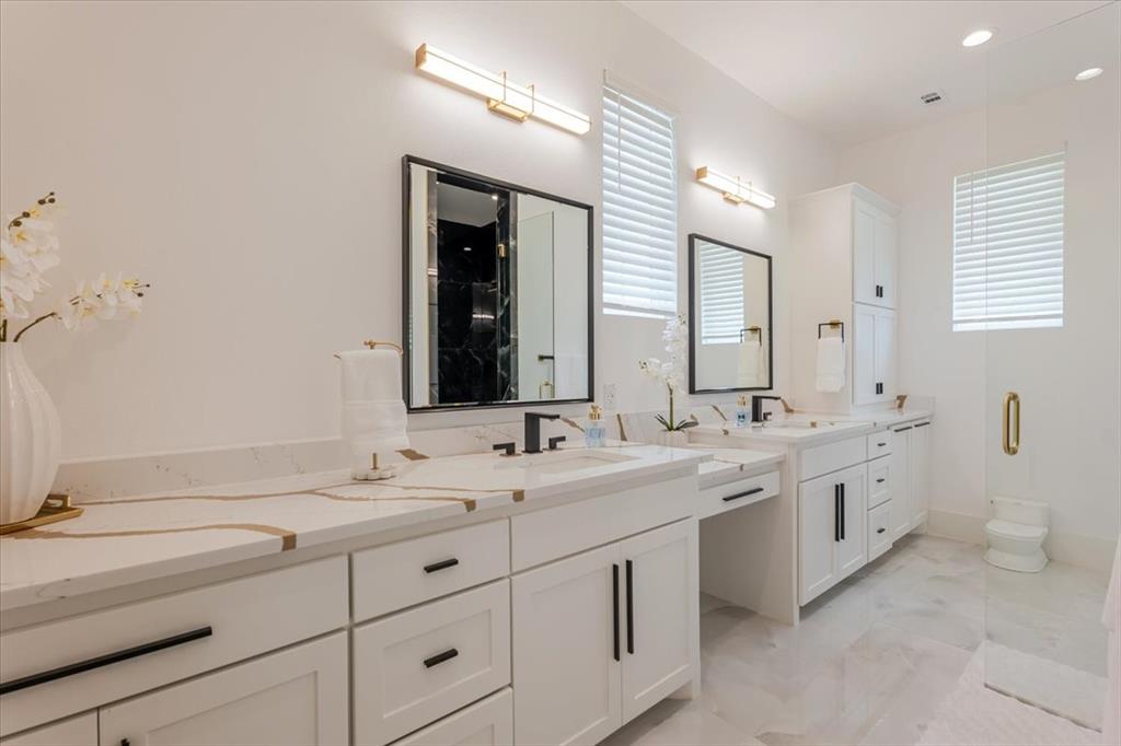 7381 Mesquite Ridge Sanger, TX 76266 - Photo 19 of 40 a bathroom with a double vanity sink mirror and toilet