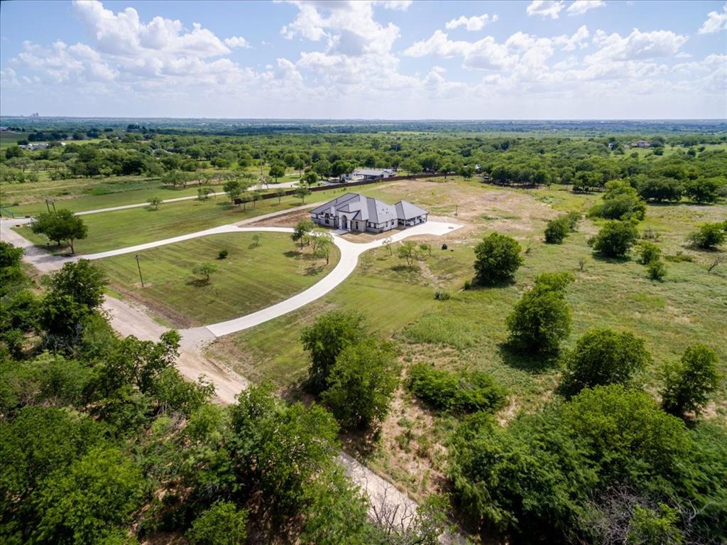 7381 Mesquite Ridge Sanger, TX 76266 - Photo 2 of 40 a view of a lake with a city