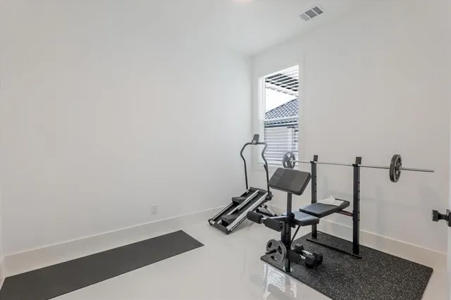 a bathroom with a sink a toilet a mirror and shower curtain