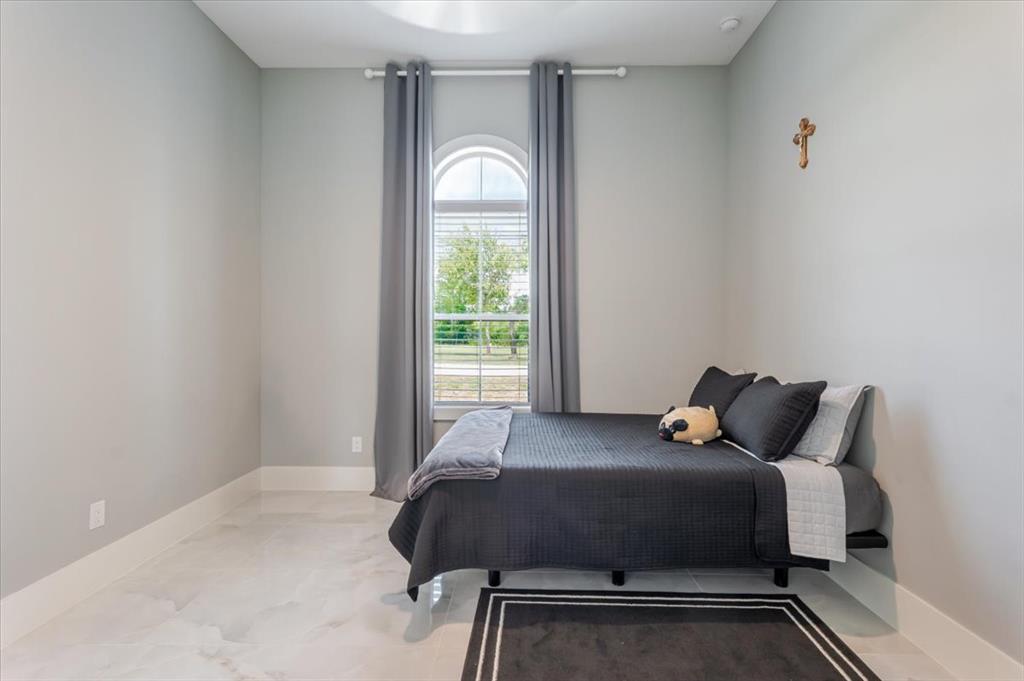 7381 Mesquite Ridge Sanger, TX 76266 - Photo 23 of 40 a bedroom with a bed and window