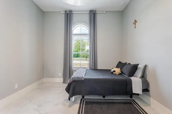 a room with a bed and a window