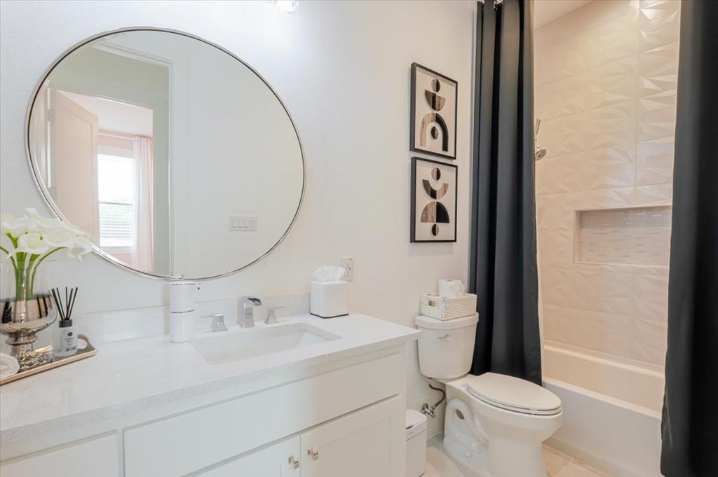 7381 Mesquite Ridge Sanger, TX 76266 - Photo 25 of 40 a bathroom with a toilet sink and mirror