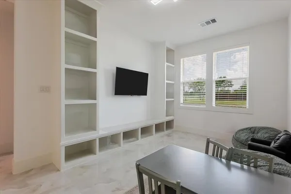 a bedroom with a bed and cabinets